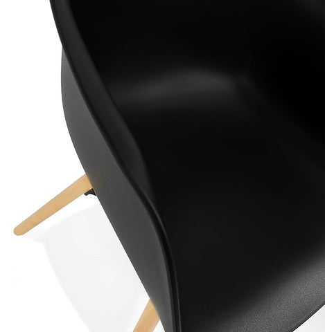 Black armchair 'MELIS' with metal and natural wood legs Black armchair 'MELIS' with metal and natural wood legs