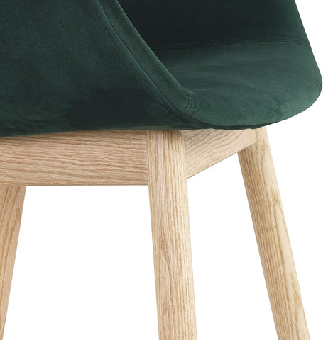 Green velvet chair 'FRIDA' with armrests and legs in natural wood